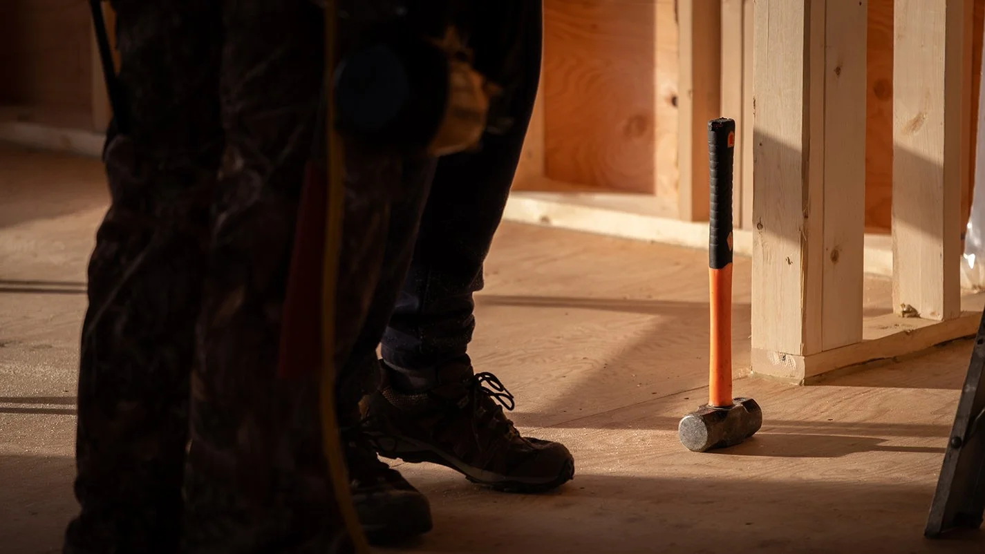 Image of framers feet with framing in the background